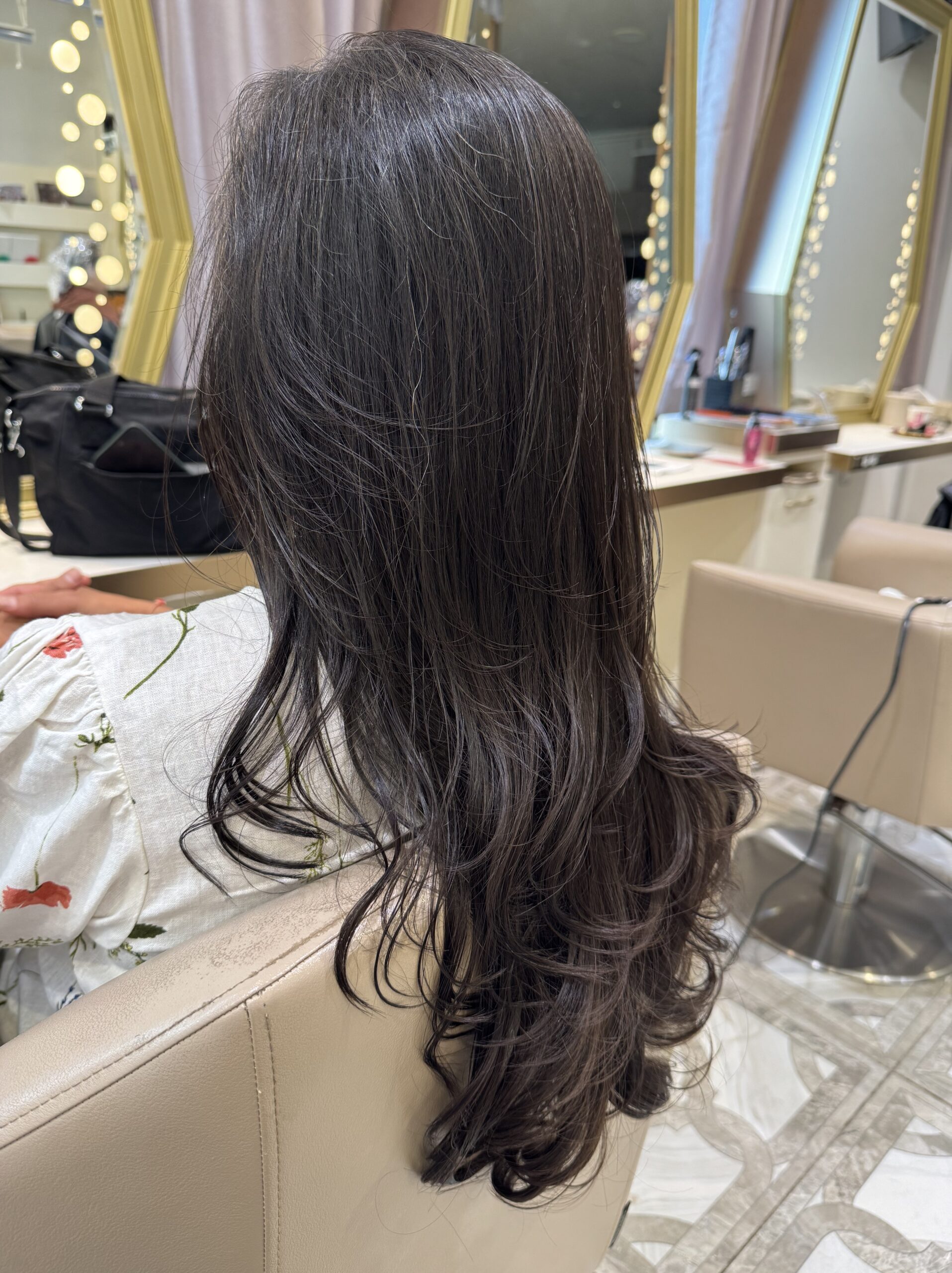 After — smoother, shinier, more manageable hair following a layer cut and X Treatment